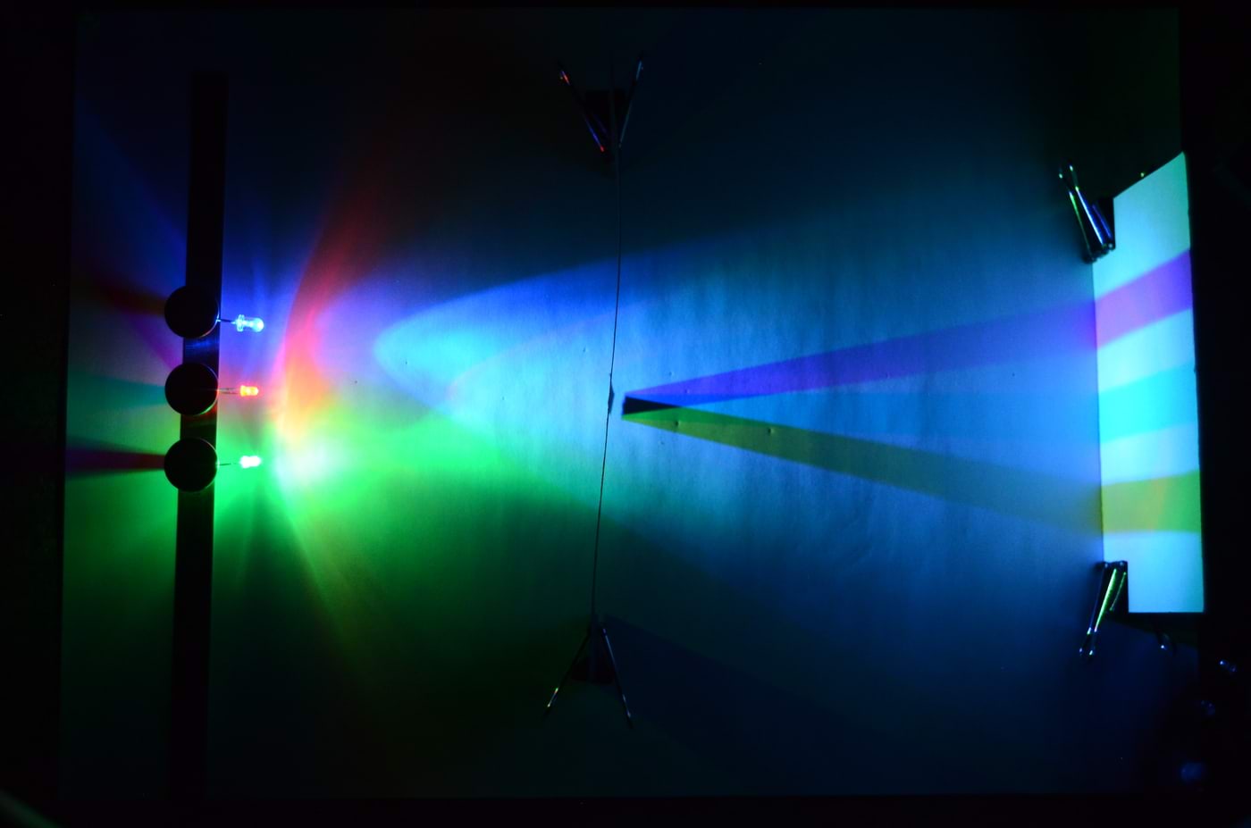 Blue, red, and green LEDs, shadows cast by the object, yellow, magenta, and cyan regions appear on the surface.